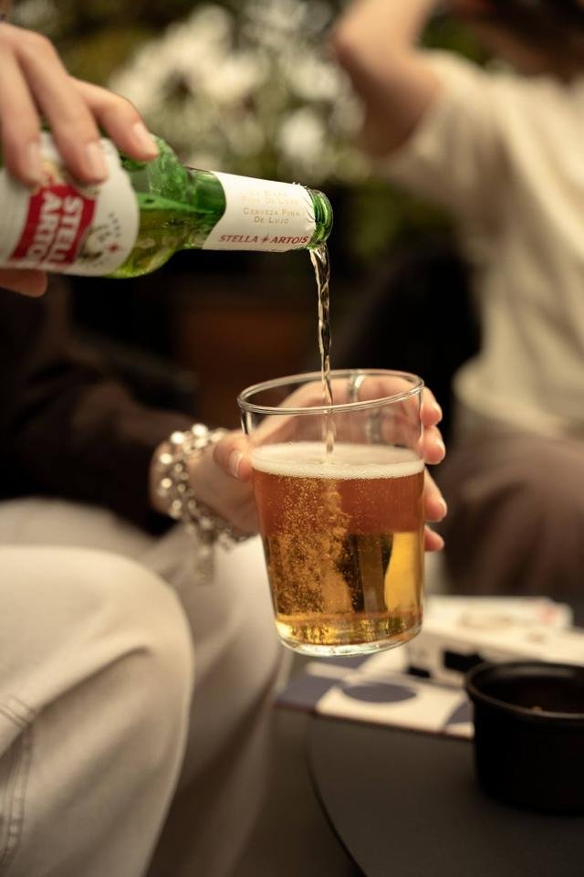 Pouring a beer on the rooftop