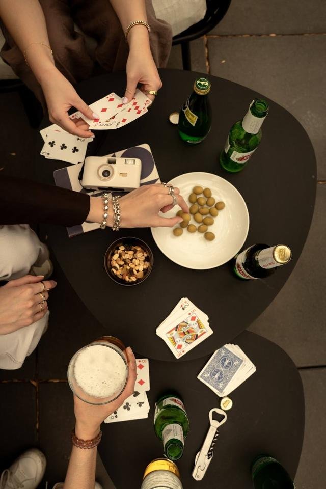 Card game and snacks on the terrace table